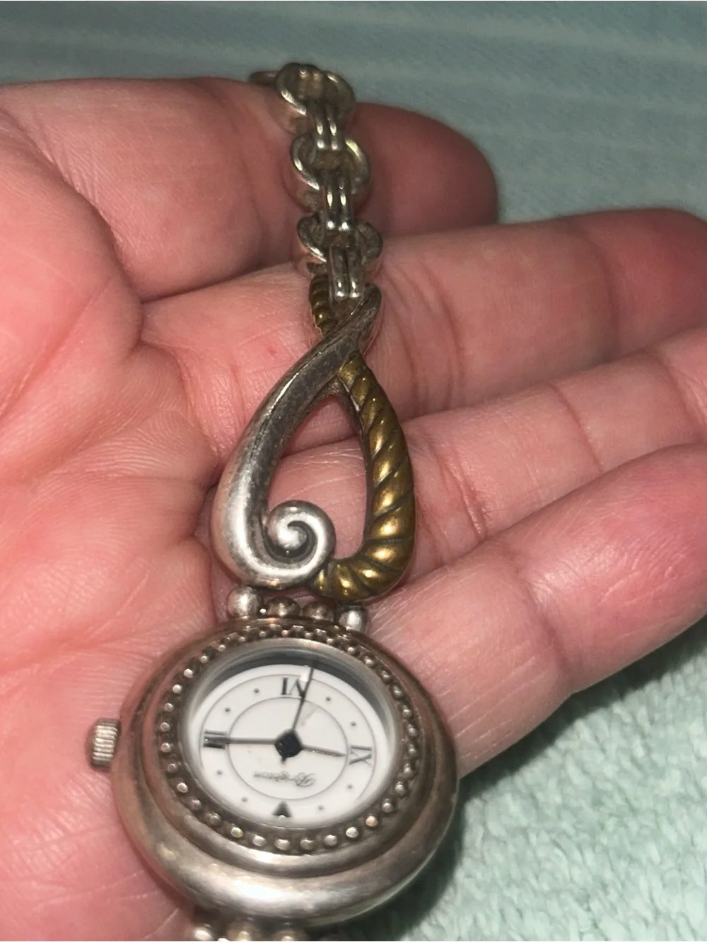 two-tone Brighton Charleston Watch featuring a round white face. RETIRED